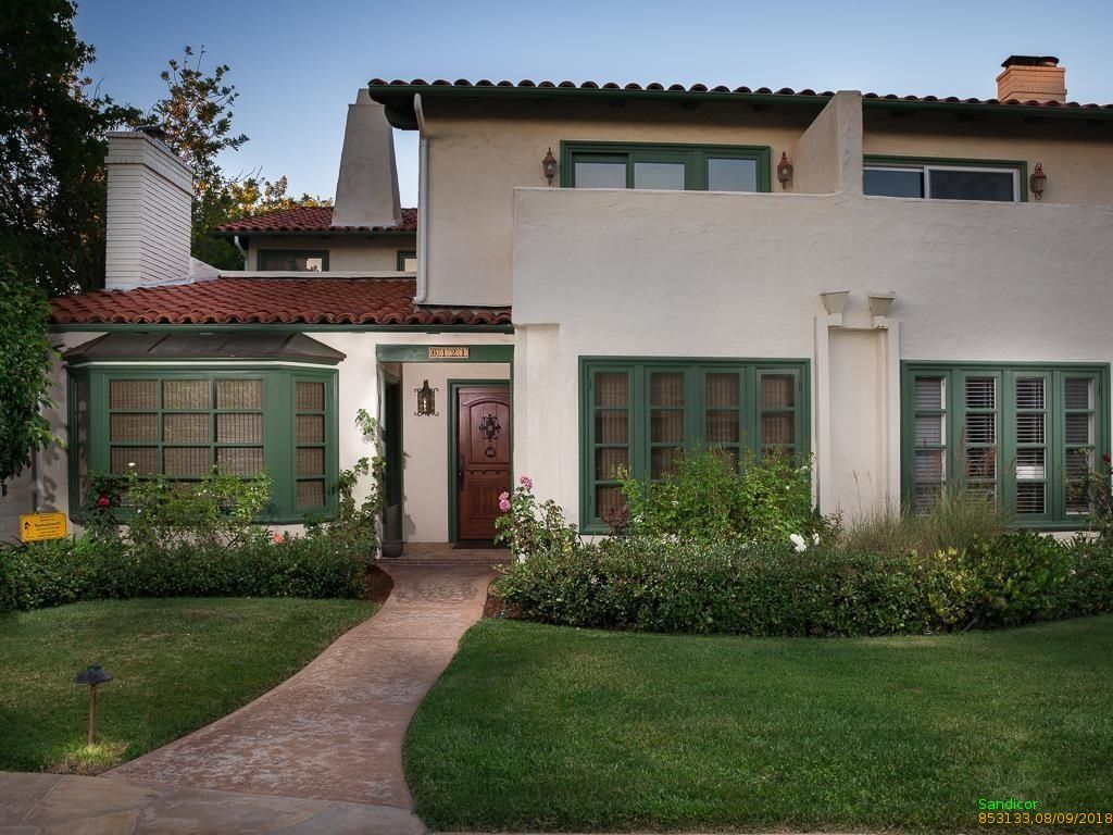 Existing Spanish colonial house on a level landscaped lot