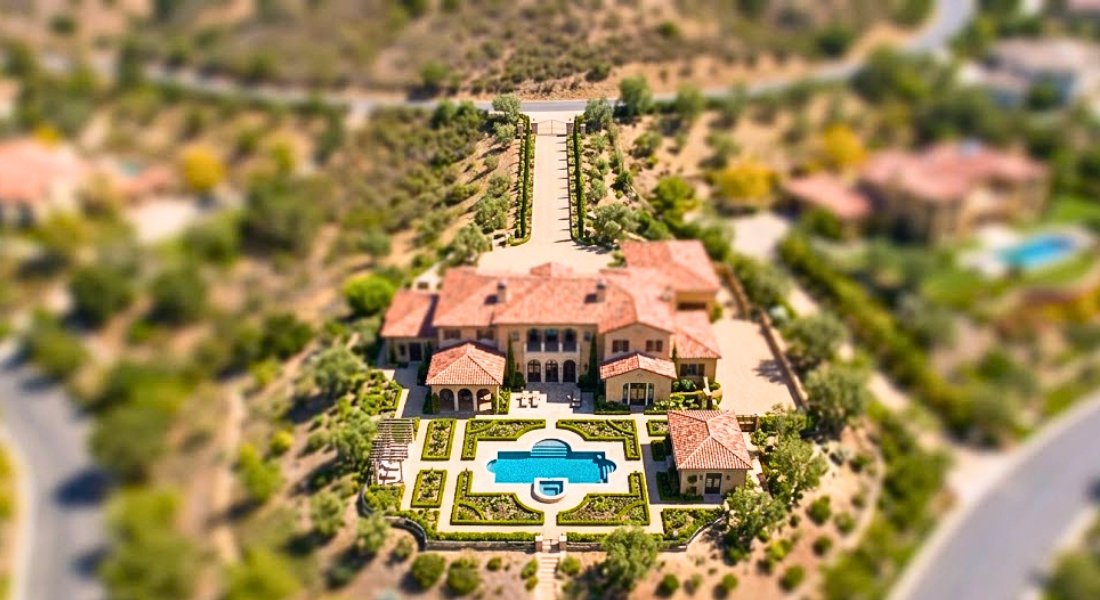 Rancho Santa Fe estate with aerial property images showing year over year changes.