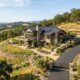 Rebuilt custom home on a hillside lot in Napa California with defensible space landscaping and clear access road